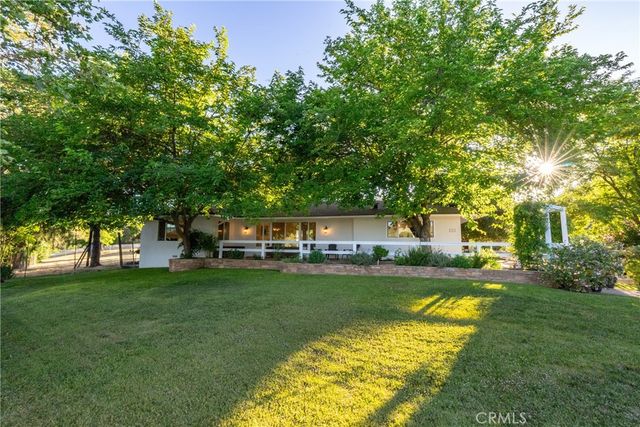 a spacious bedroom with a bed and a large window