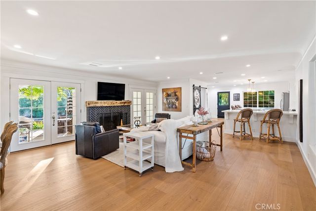 a balcony with wooden floor and furniture