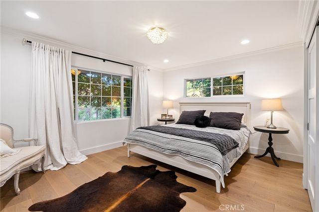 a view of a patio with table and chairs and wooden floor
