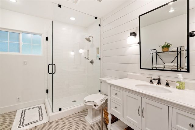 a view of a patio with lawn chairs next to a yard