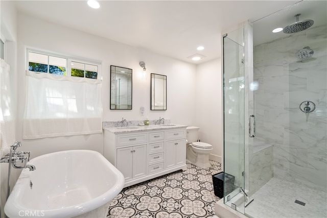a view of a chairs and table in the balcony