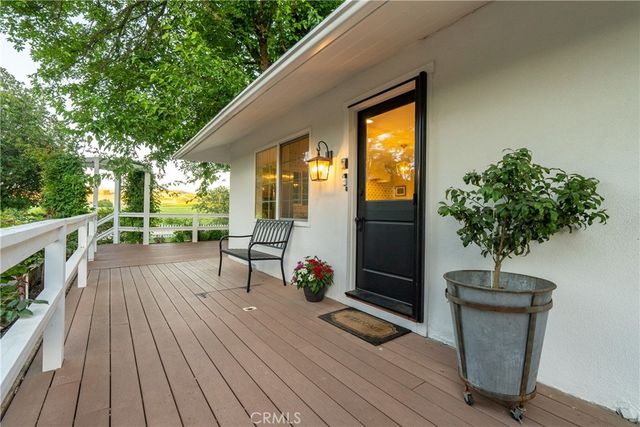 a bathroom with a granite countertop sink and a window