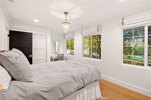 a swimming pool with trees in the background