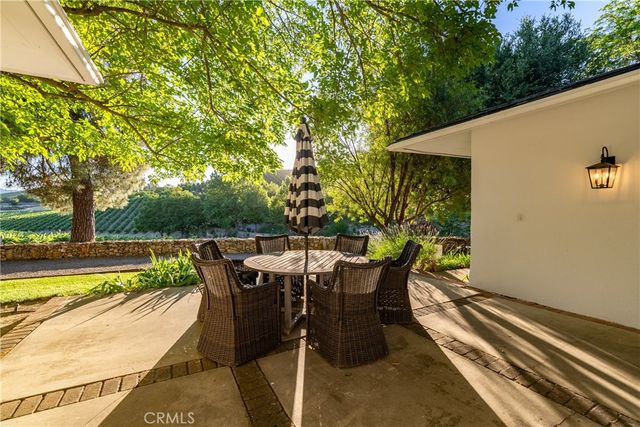 an aerial view of a houses with a yard