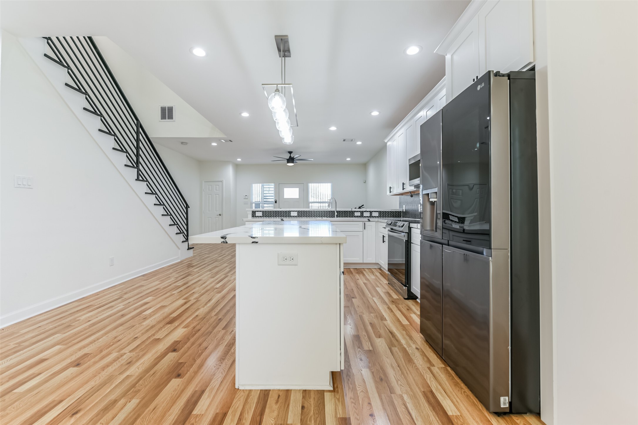 4830 Burma Road, Unit A B Houston, TX 77033 - Photo 12 of 34 a kitchen with stainless steel appliances granite countertop a refrigerator a sink and a stove