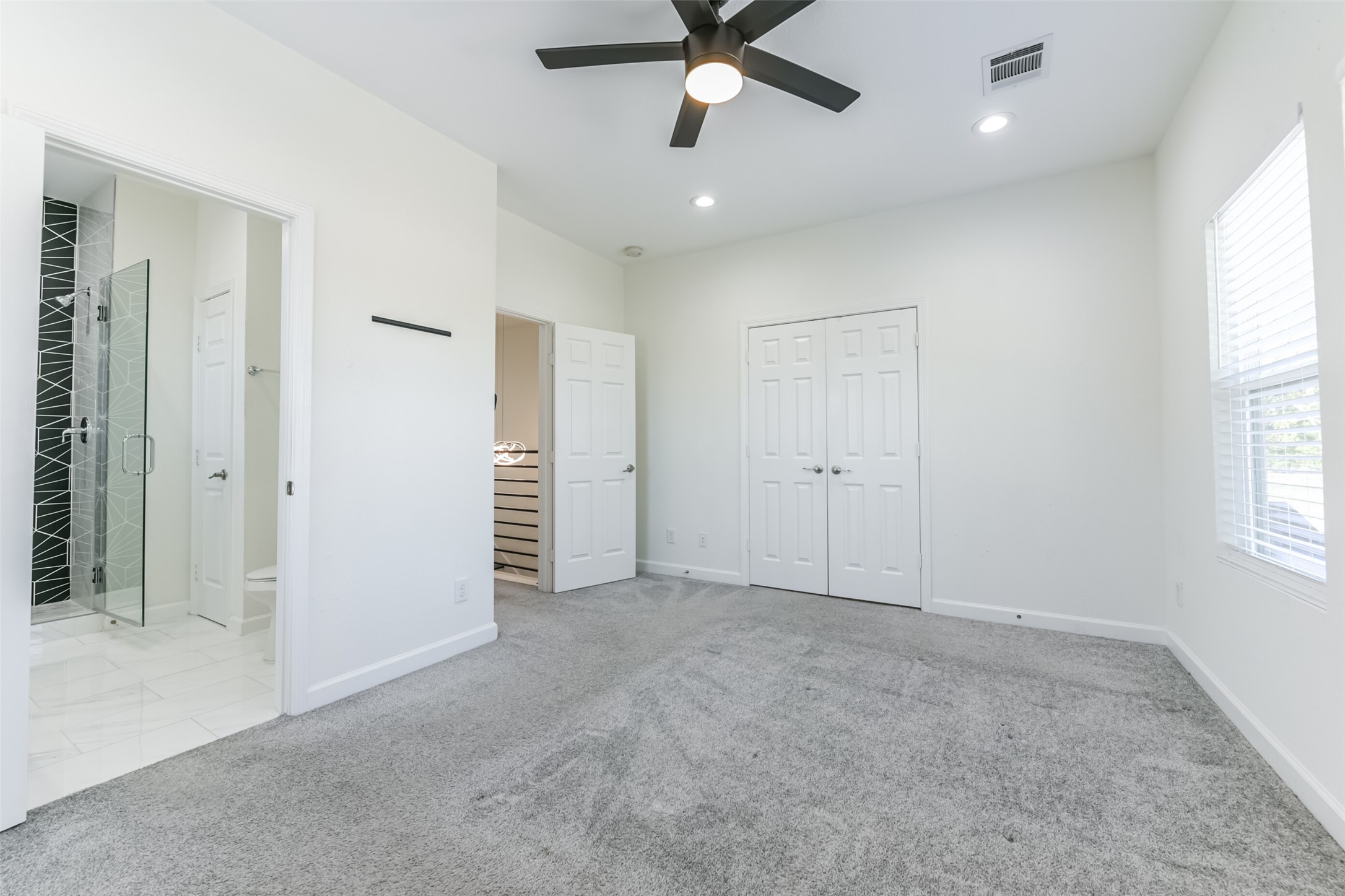 4830 Burma Road, Unit A B Houston, TX 77033 - Photo 27 of 34 wooden floor in an empty room with a window