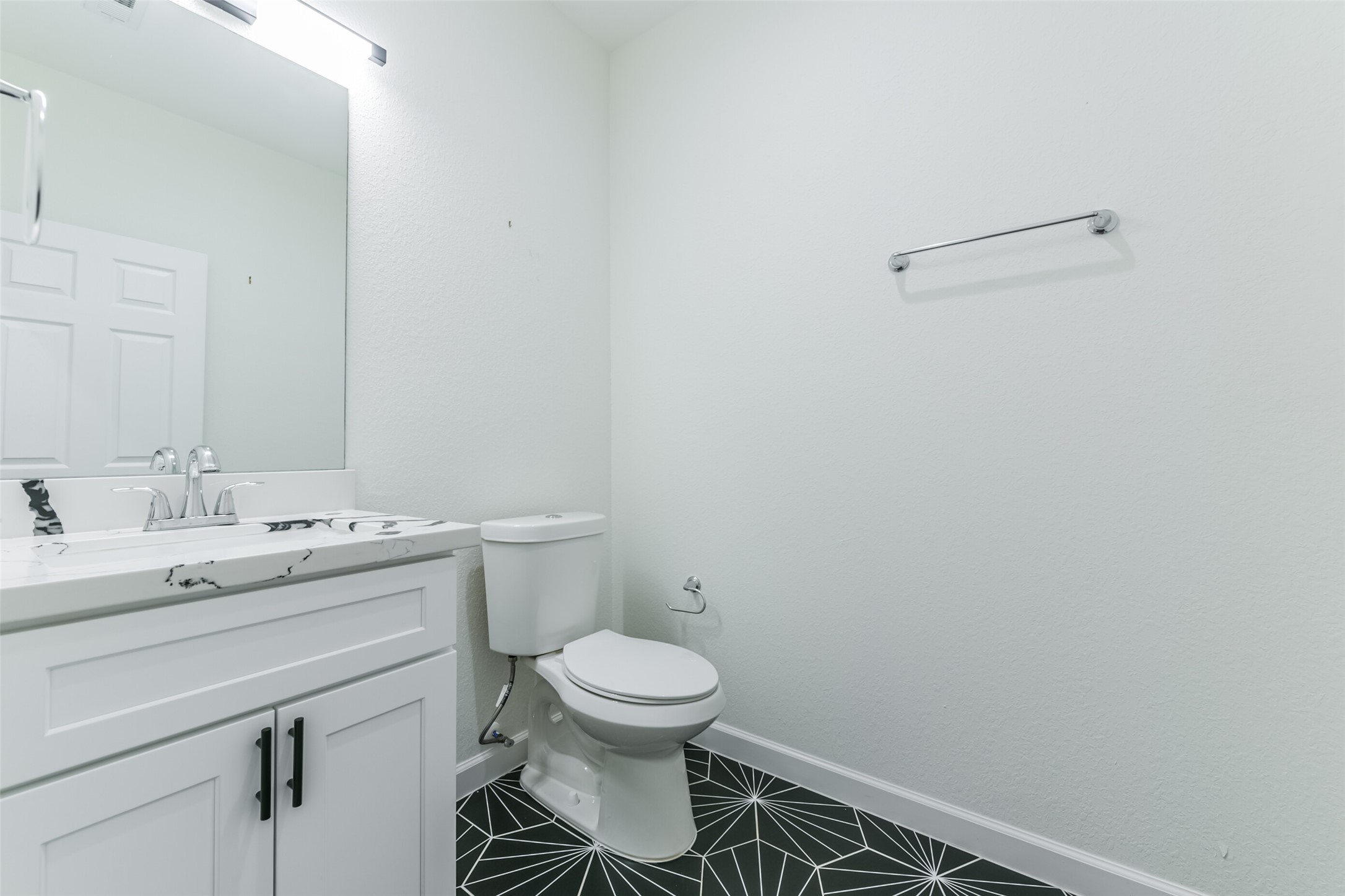 4830 Burma Road, Unit A B Houston, TX 77033 - Photo 29 of 34 a bathroom with a granite countertop toilet and a sink