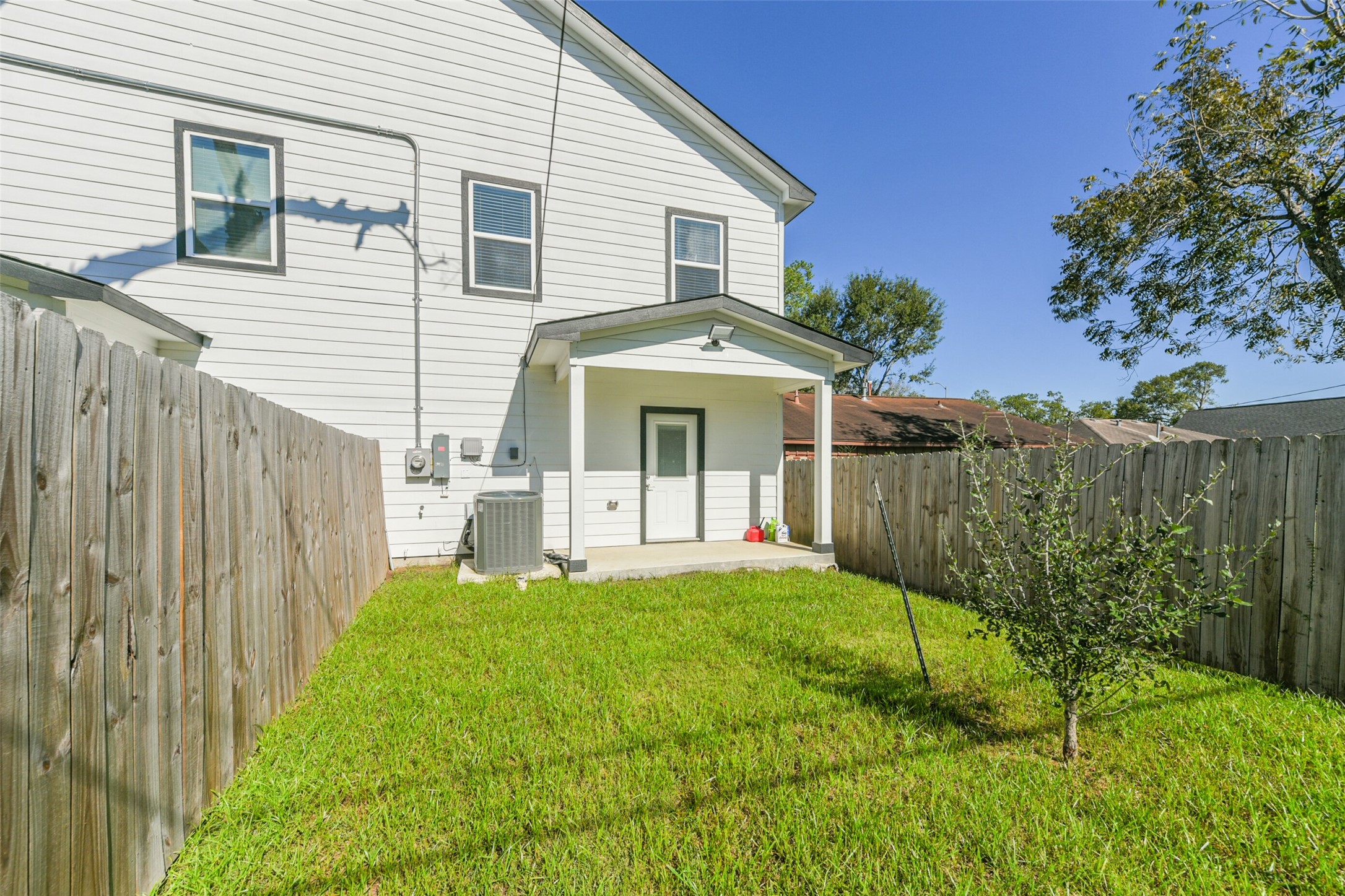 4830 Burma Road, Unit A B Houston, TX 77033 - Photo 34 of 34 a front view of a house with a yard and garage