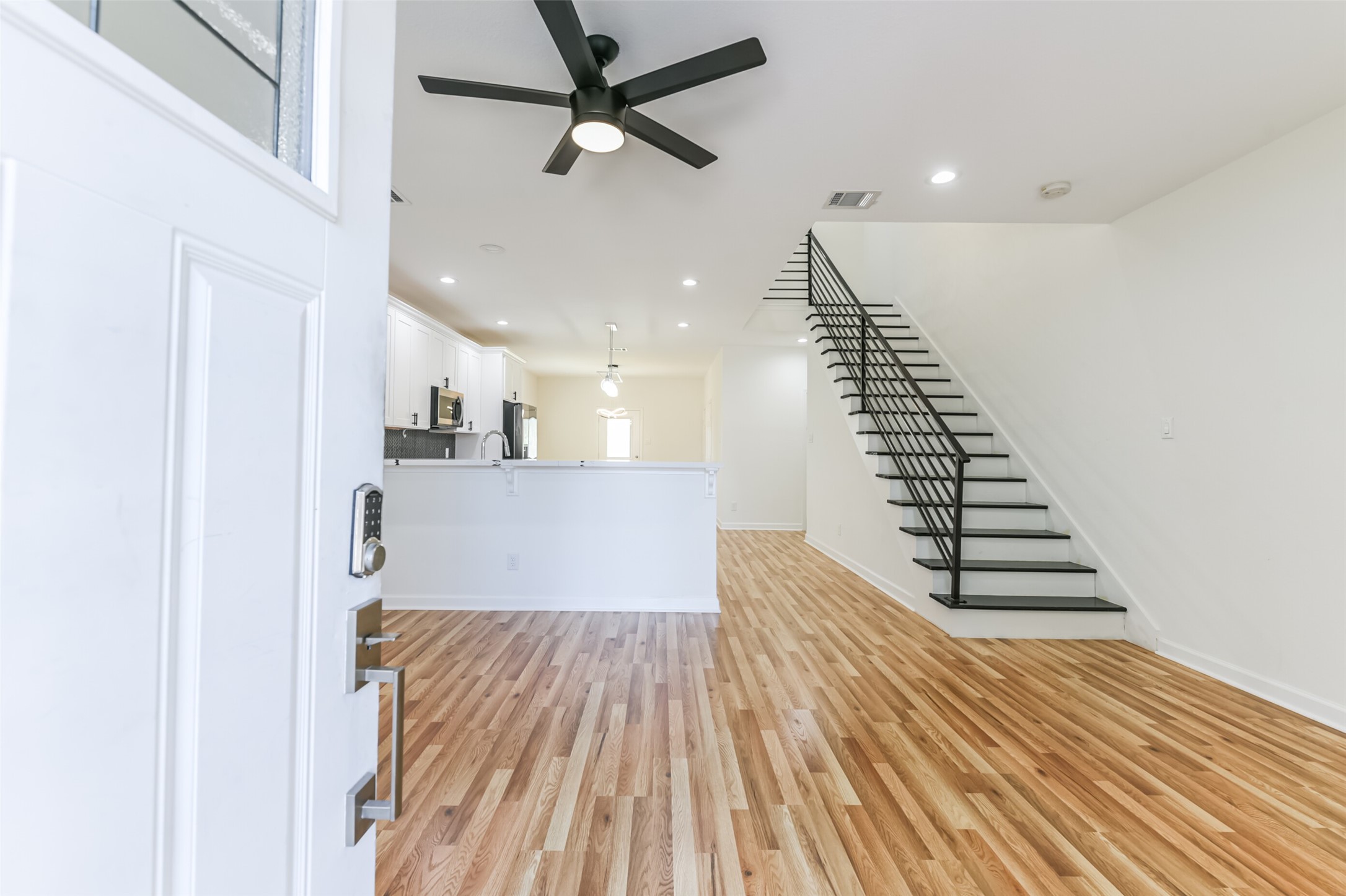 4830 Burma Road, Unit A B Houston, TX 77033 - Photo 4 of 34 wooden floor in a hall with an entryway