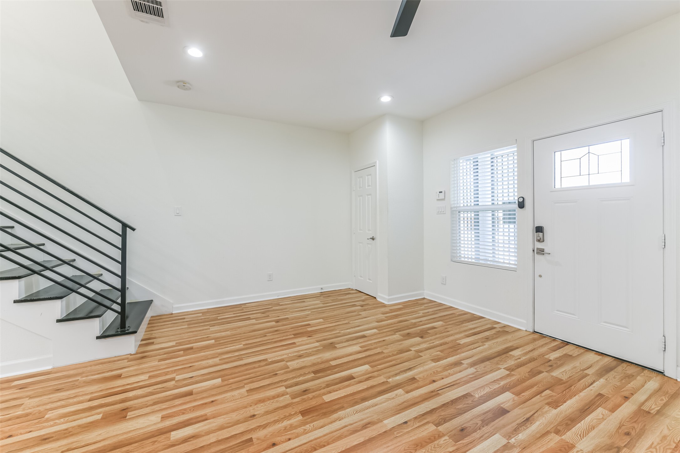 4830 Burma Road, Unit A B Houston, TX 77033 - Photo 6 of 34 a view of empty room with wooden floor