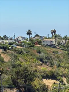 a view of a town with mountains in the background