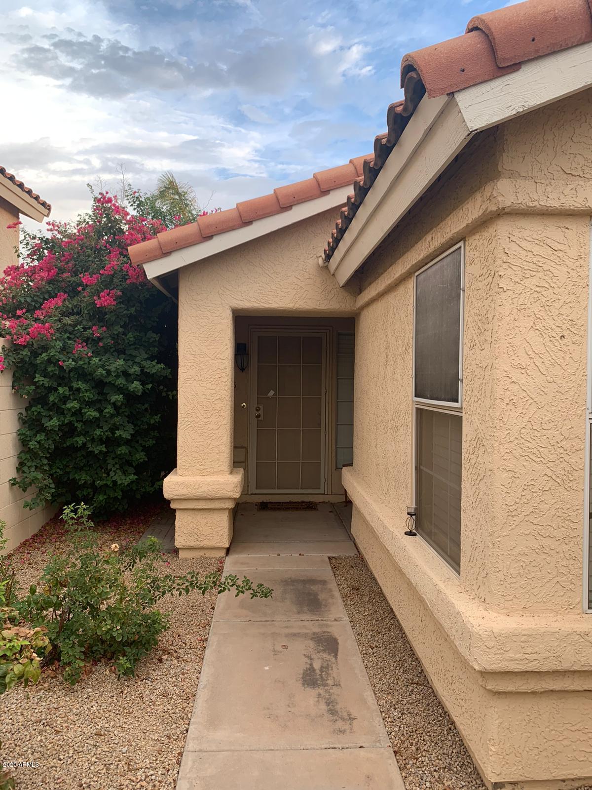 4745 East St John Road Phoenix, AZ 85032 - Photo 2 of 20 a front view of a house with plants