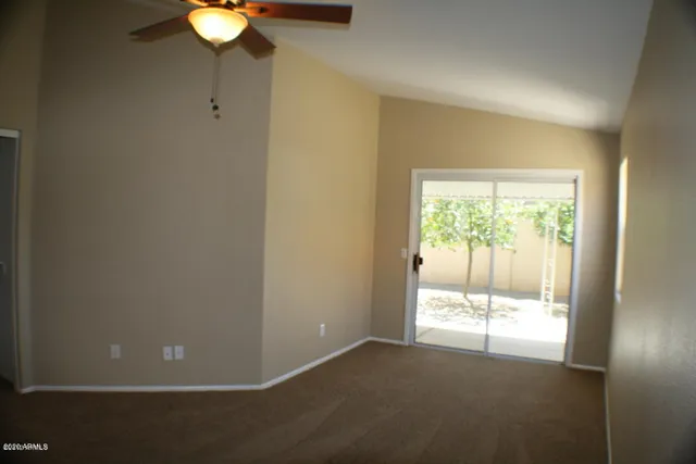 a view of an empty room and window