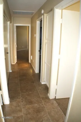 a bathroom with a shower and a sink