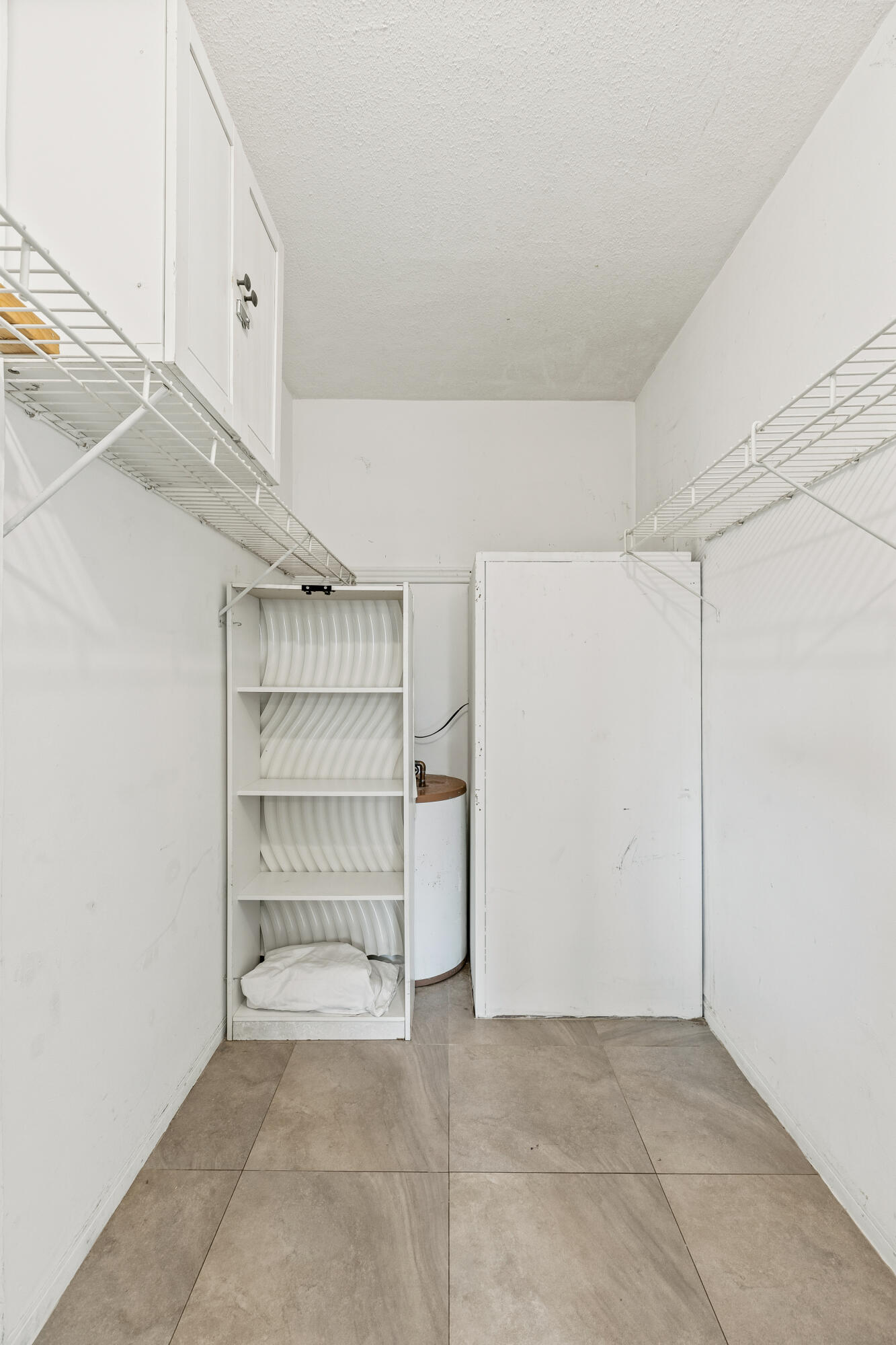 1021 Northeast 24th Avenue, Unit 12 Pompano Beach, FL 33062 - Photo 25 of 33 a view of an empty walk in closet