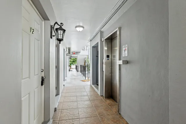 a hallway with sliding door and entryway