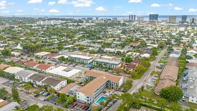 an aerial view of residential houses with outdoor space