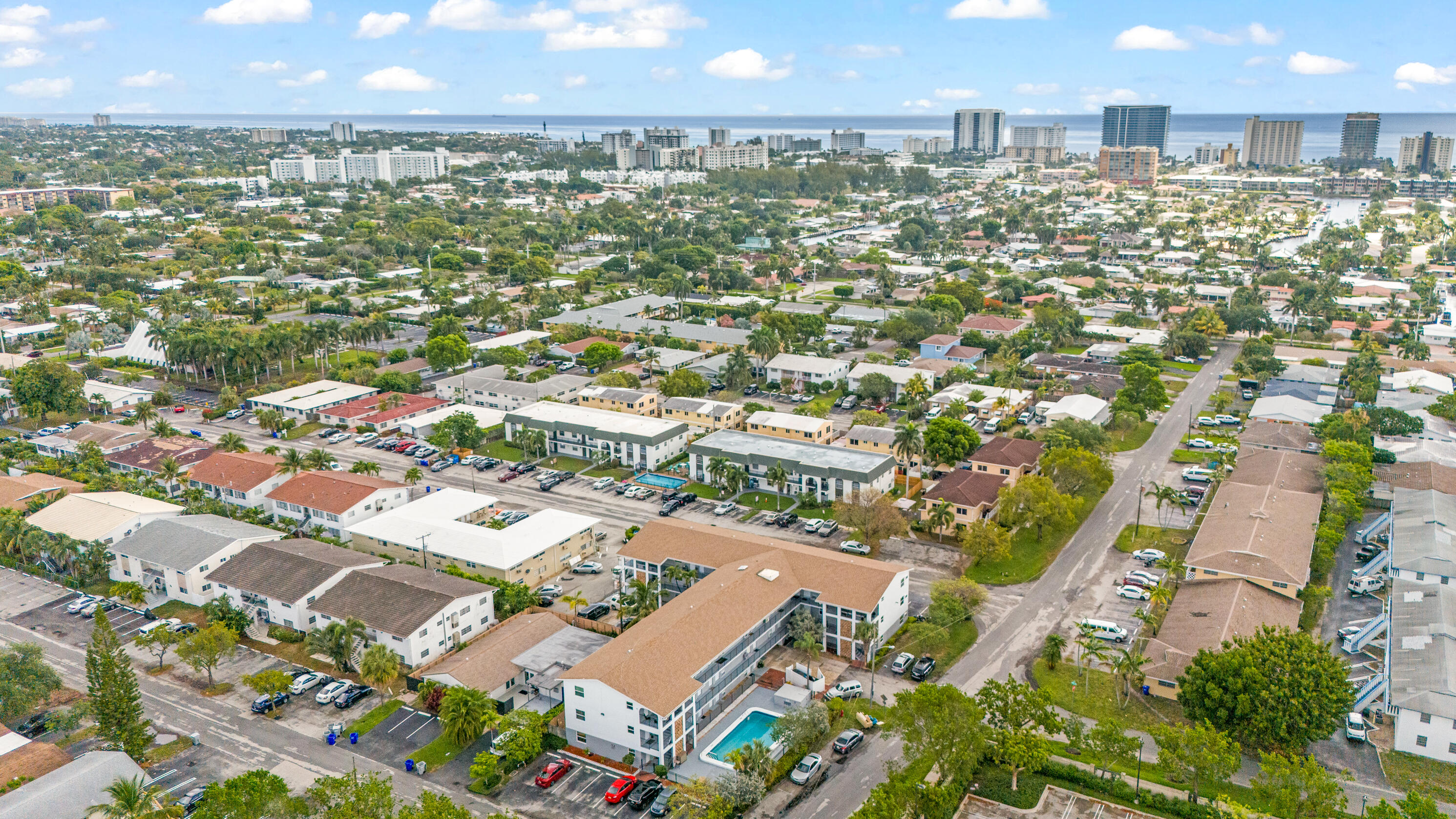 1021 Northeast 24th Avenue, Unit 12 Pompano Beach, FL 33062 - Photo 4 of 33 an aerial view of residential houses with outdoor space