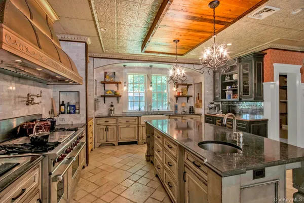 a kitchen with granite countertop lots of counter top space and stainless steel appliances