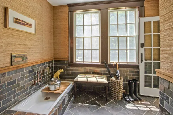 a bathroom with a sink and a window