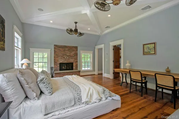 a bed room with a bed and a chair