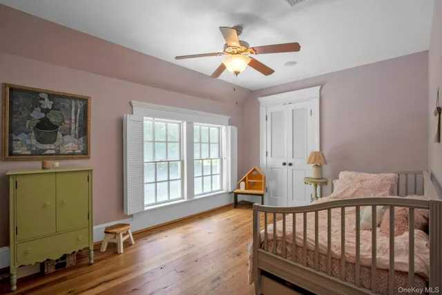 a view of a livingroom with furniture and a window