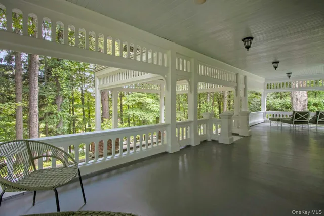 a view of a balcony with chairs