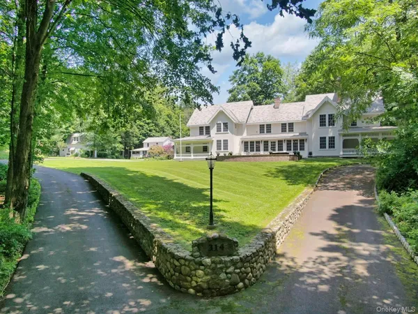 a view of a house with a yard porch and sitting area