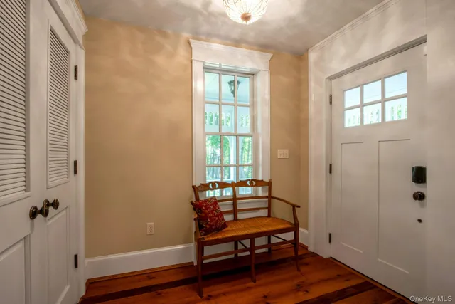 a view of a room with wooden floor and windows