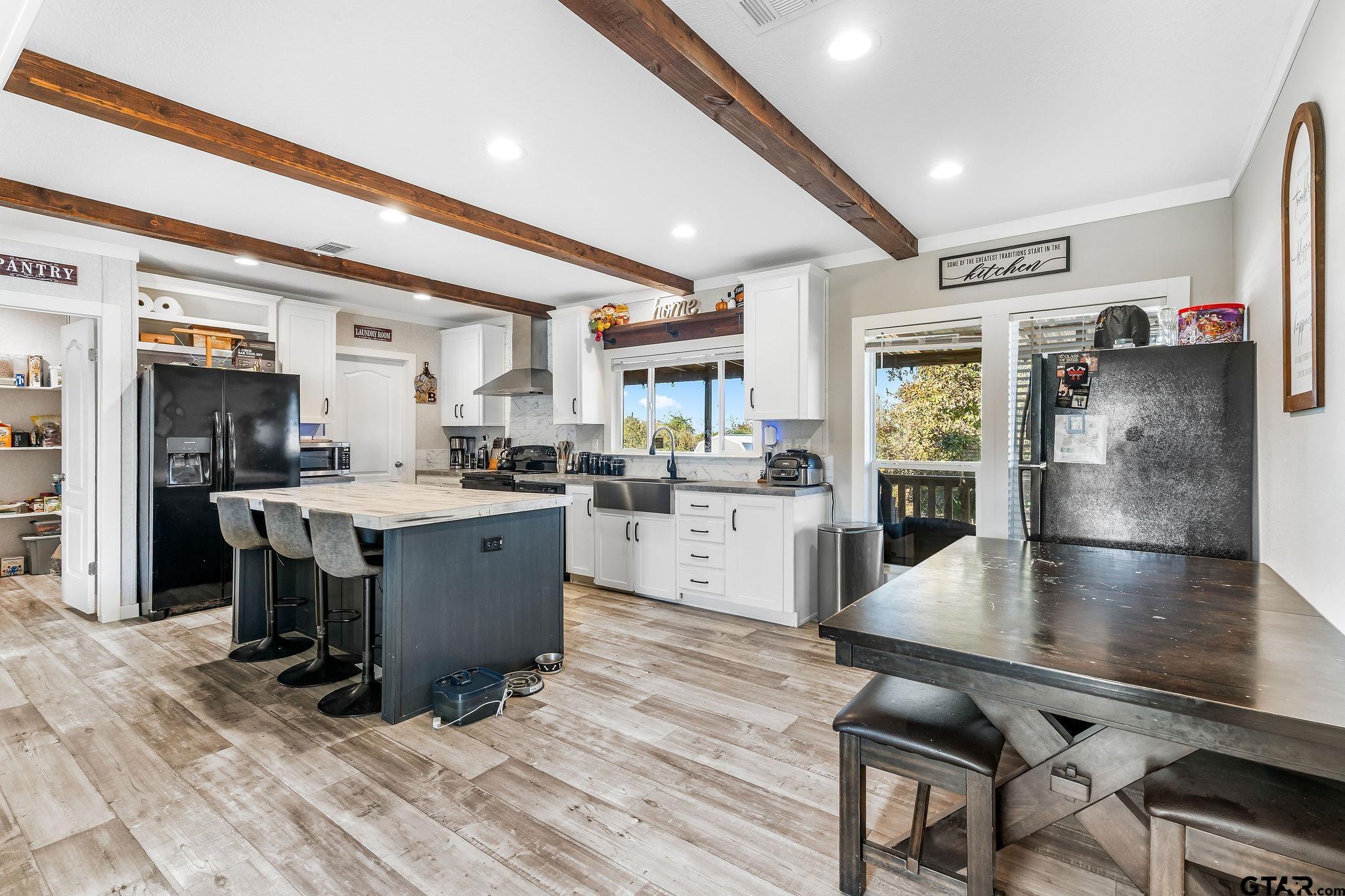 1255 Raintree Lakes Circle Big Sandy, TX 75755 - Photo 11 of 28 a kitchen with counter top space and stainless steel appliances