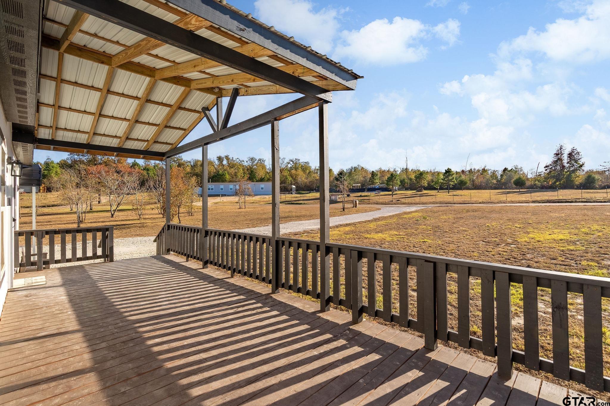 1255 Raintree Lakes Circle Big Sandy, TX 75755 - Photo 16 of 27 a view of wooden balcony with outdoor space