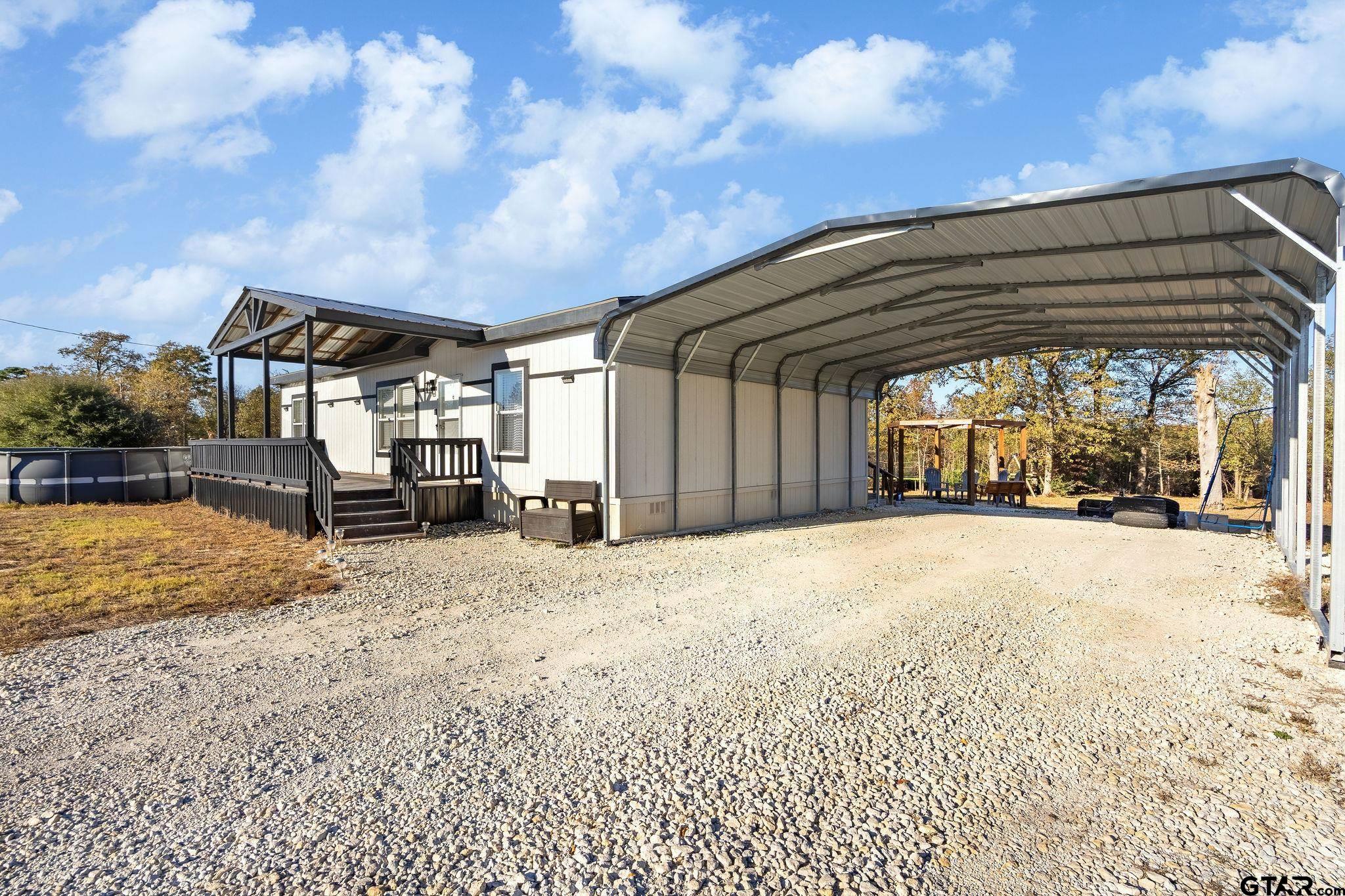 1255 Raintree Lakes Circle Big Sandy, TX 75755 - Photo 19 of 28 a view of a house with backyard