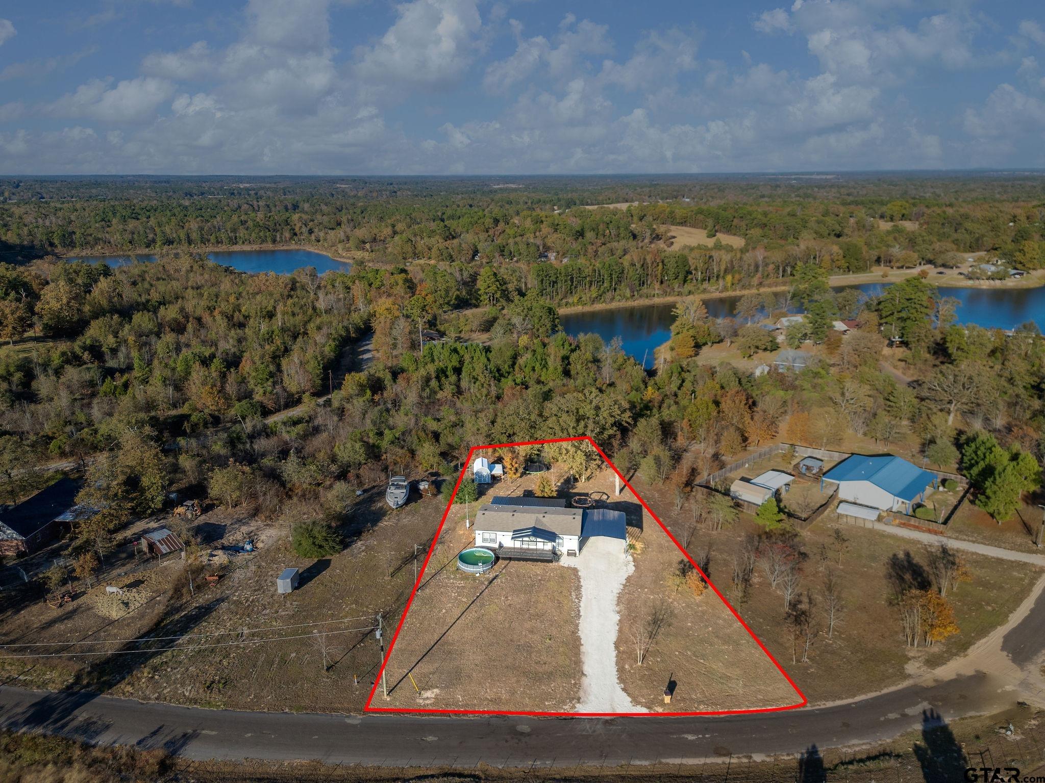 1255 Raintree Lakes Circle Big Sandy, TX 75755 - Photo 26 of 28 a view of a balcony with an ocean view