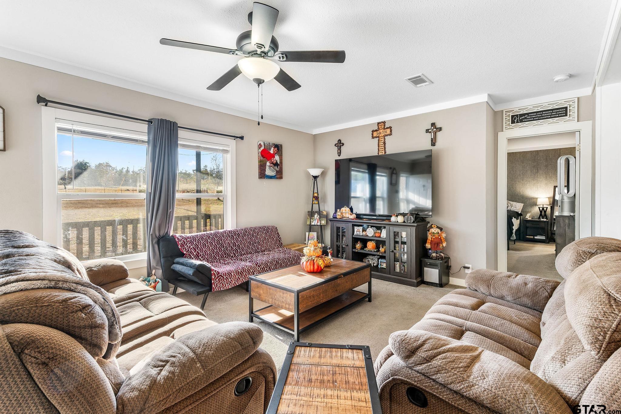 1255 Raintree Lakes Circle Big Sandy, TX 75755 - Photo 3 of 27 a living room with furniture and a large window