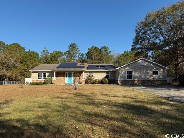 Single story home with roof mounted solar panels