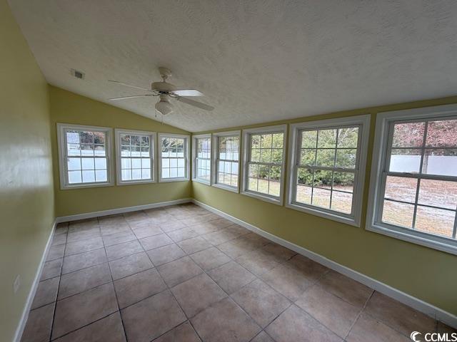 983 Nottingham Lakes Road Conway, SC 29526 - Photo 26 of 27 Unfurnished sunroom featuring lofted ceiling, a textured ceiling, and tile patterned floors