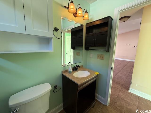 983 Nottingham Lakes Road Conway, SC 29526 - Photo 9 of 27 Bathroom with vanity and dark tile patterned flooring