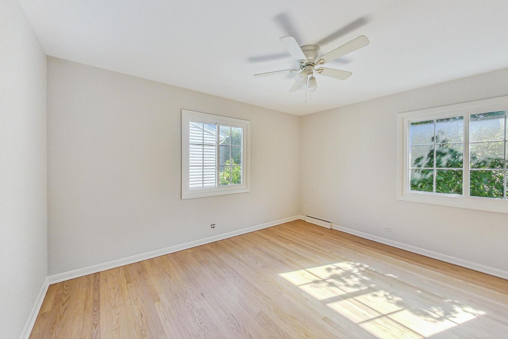157 Riverside Drive Northfield, IL 60093 - Photo 15 of 21 wooden floor in an empty room with a window