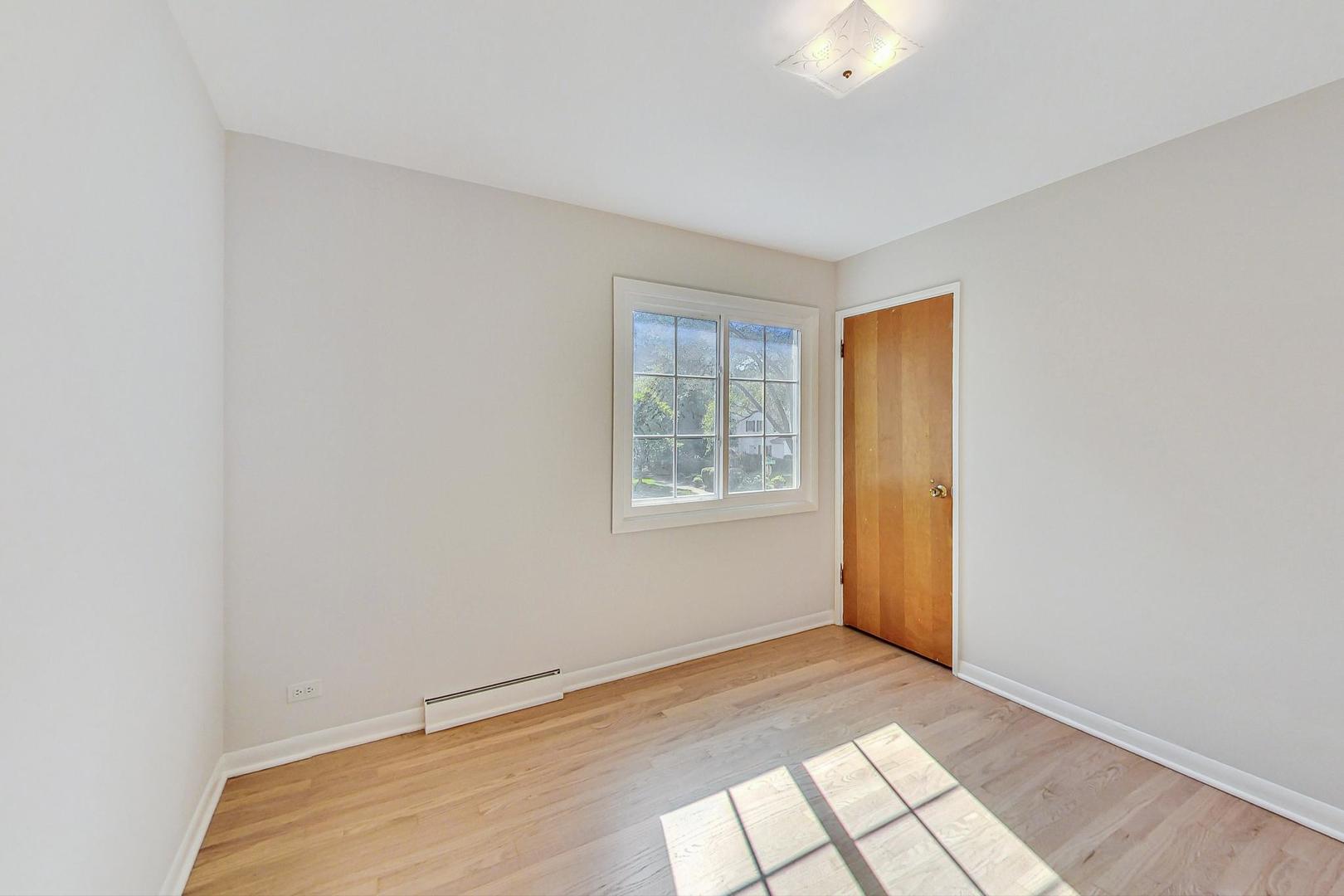 157 Riverside Drive Northfield, IL 60093 - Photo 16 of 21 a view of an empty room and window