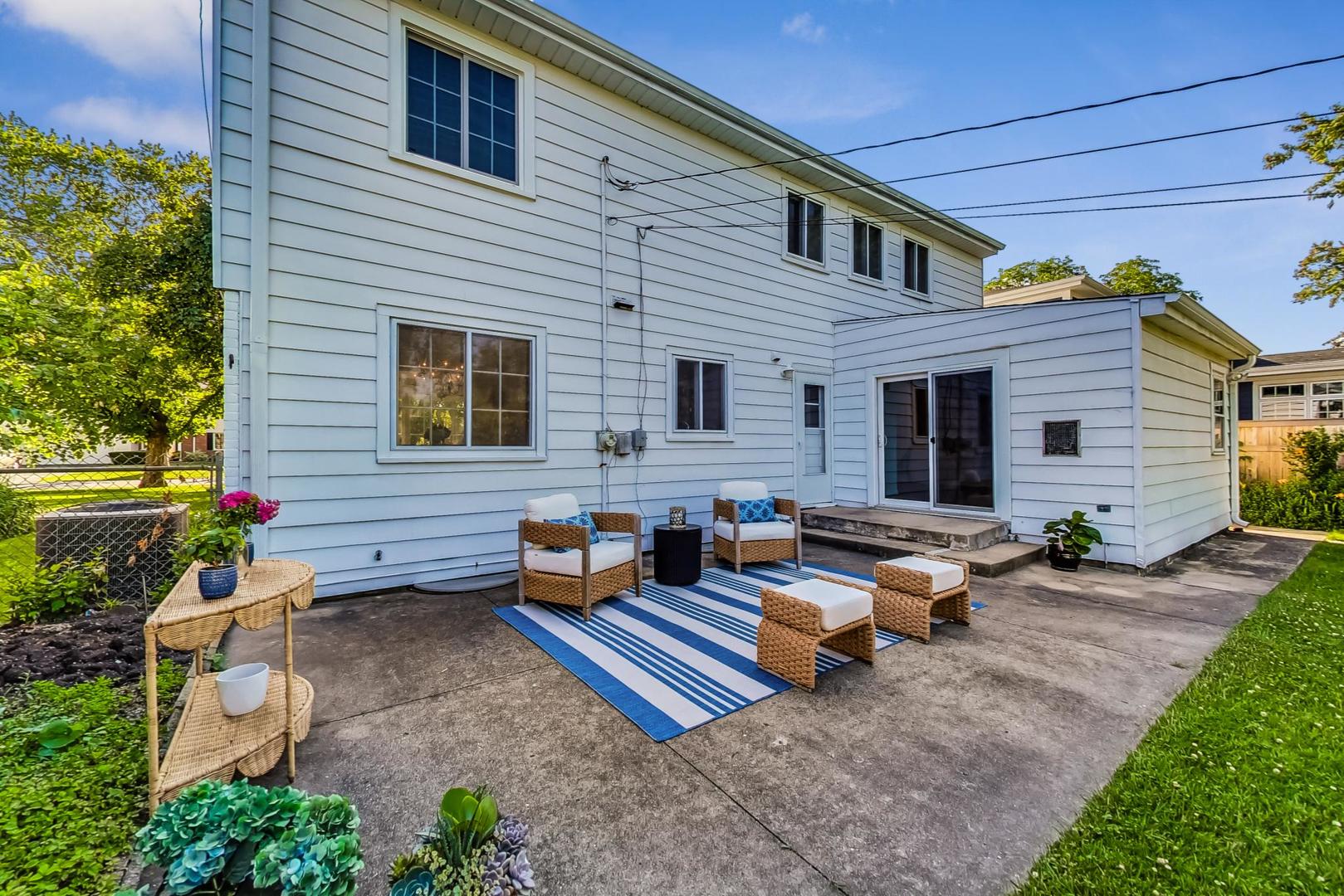 157 Riverside Drive Northfield, IL 60093 - Photo 18 of 21 a view of a house with backyard and sitting area