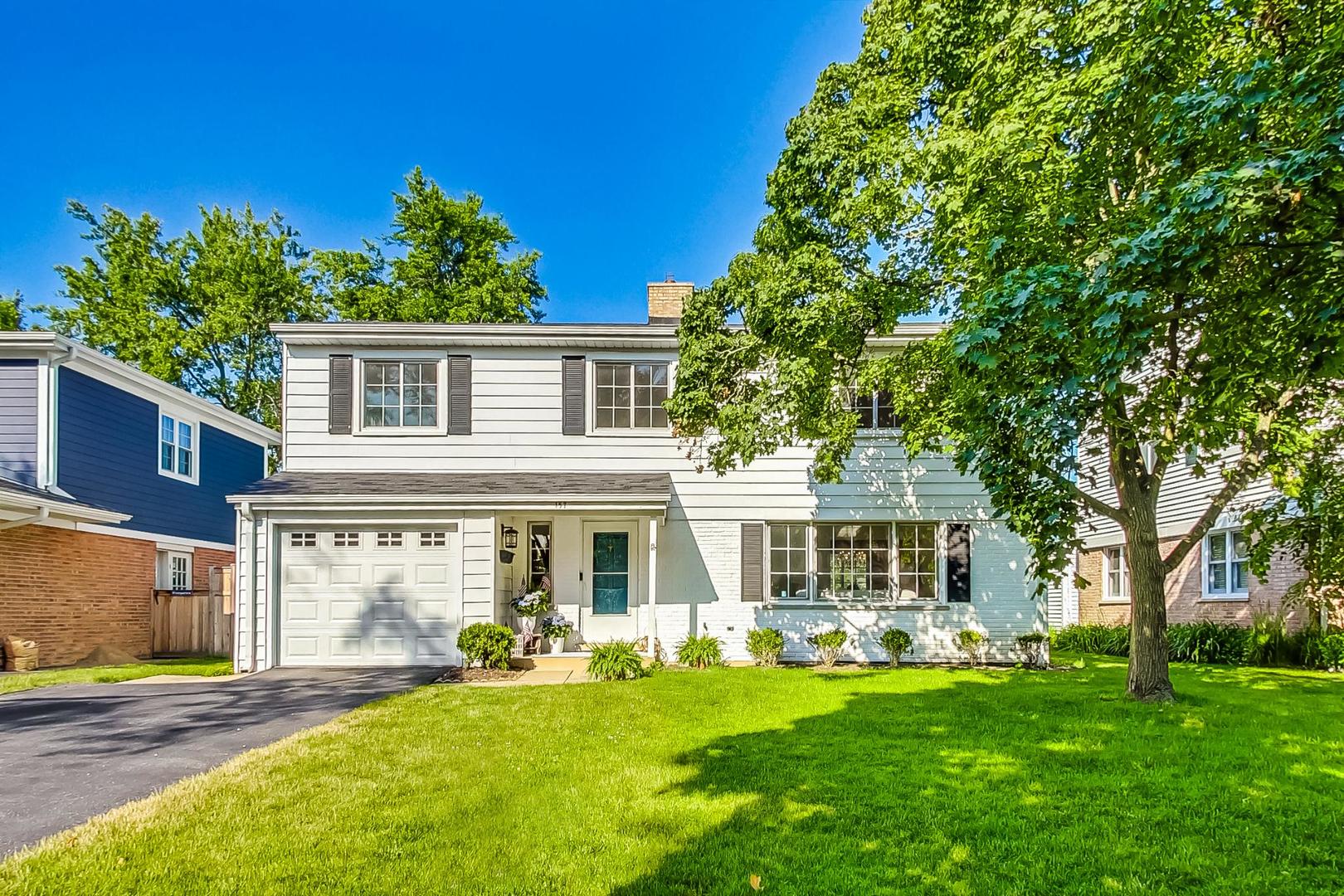 157 Riverside Drive Northfield, IL 60093 - Photo 2 of 21 front view of a house with a yard