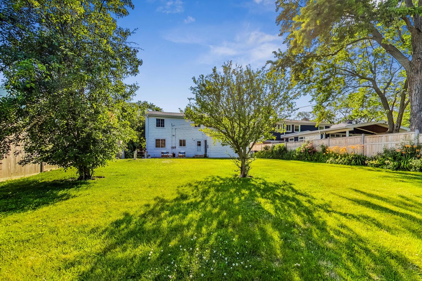 157 Riverside Drive Northfield, IL 60093 - Photo 21 of 21 a view of a house with a yard