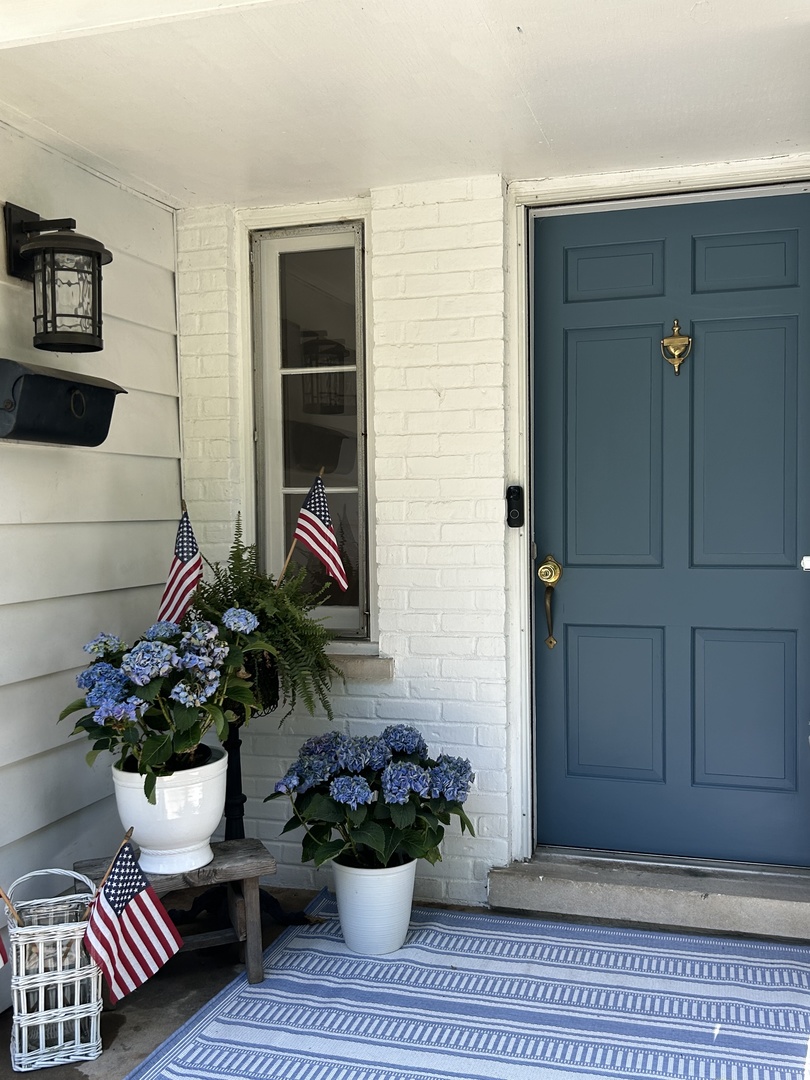 157 Riverside Drive Northfield, IL 60093 - Photo 3 of 21 a house with a potted plant