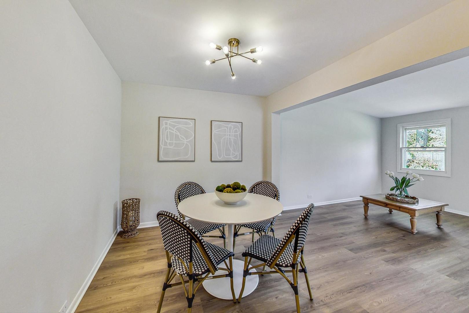 157 Riverside Drive Northfield, IL 60093 - Photo 8 of 21 a view of a dining room with furniture and wooden floor