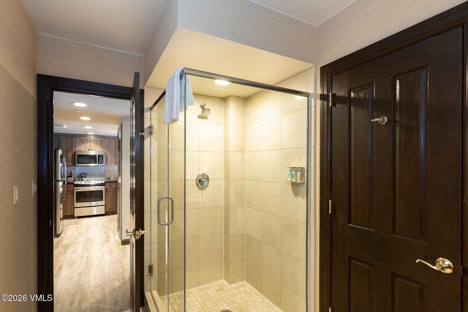 210 Offerson Road, Unit R305 WEEK 14 Beaver Creek, CO 81620 - Photo 11 of 24 a bathroom with a shower and a glass door