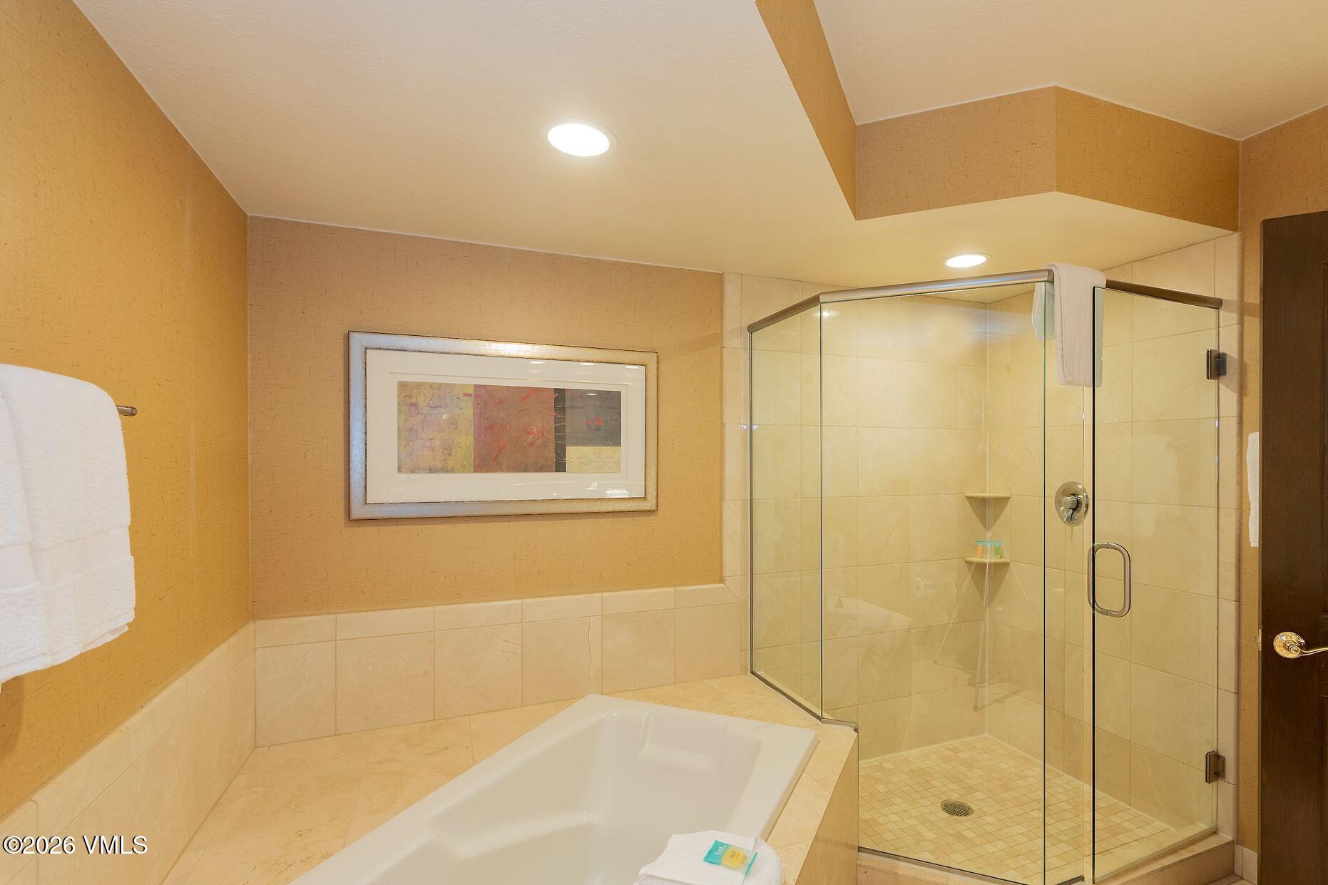 210 Offerson Road, Unit R305 WEEK 14 Beaver Creek, CO 81620 - Photo 16 of 24 a bathroom with a bathtub and shower