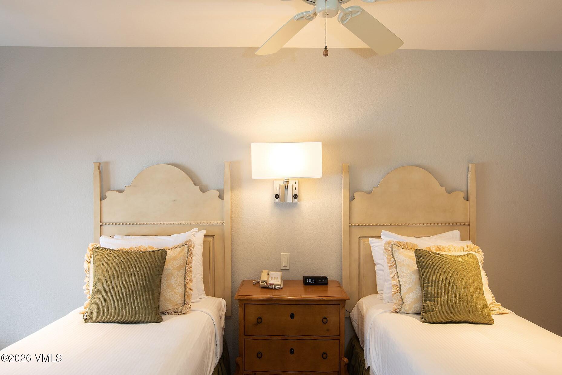 210 Offerson Road, Unit R305 WEEK 14 Beaver Creek, CO 81620 - Photo 17 of 24 a bedroom with a bed and a dresser