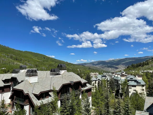 a bathroom with a shower and a glass door