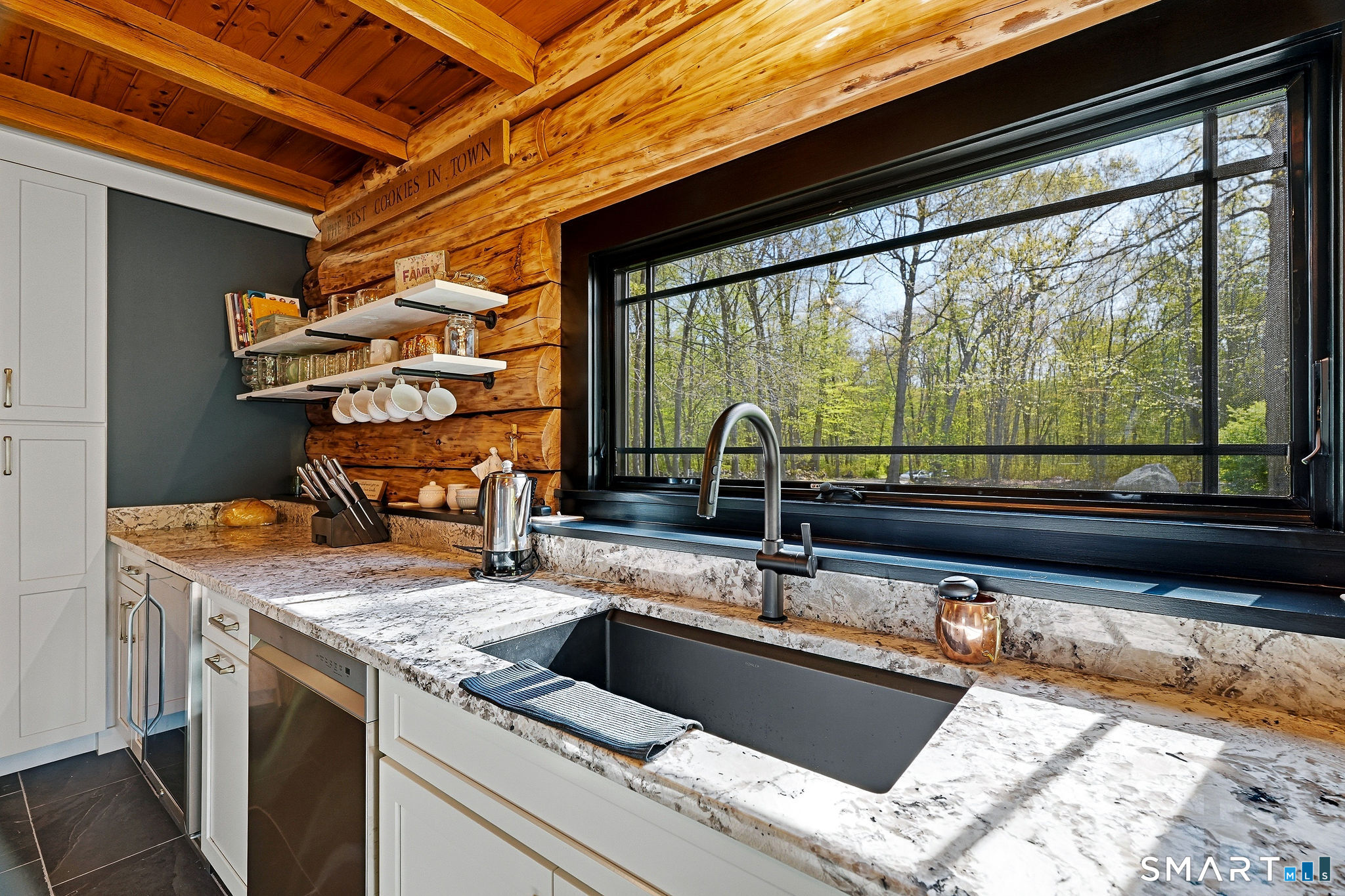 61 Mystic Road North Stonington, CT 06359 - Photo 19 of 40 a kitchen with a sink and a large window