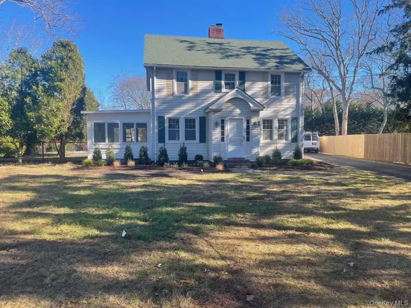 a view of a big house with a big yard